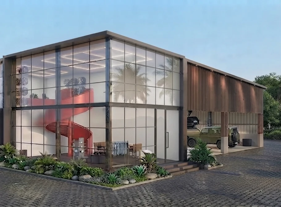 Corner view of the glazed showroom and red spiral stair