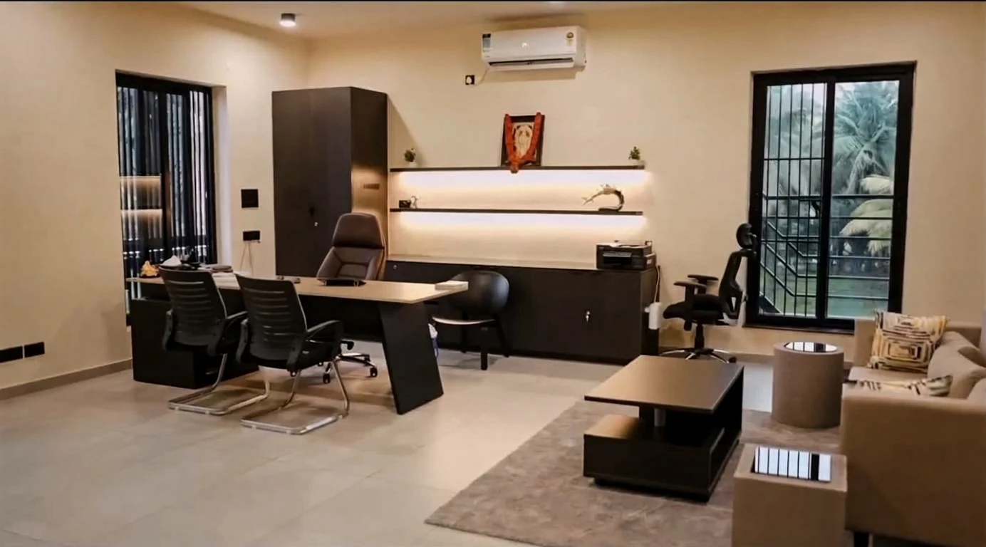 Completed office with desk, seating and warm lighting